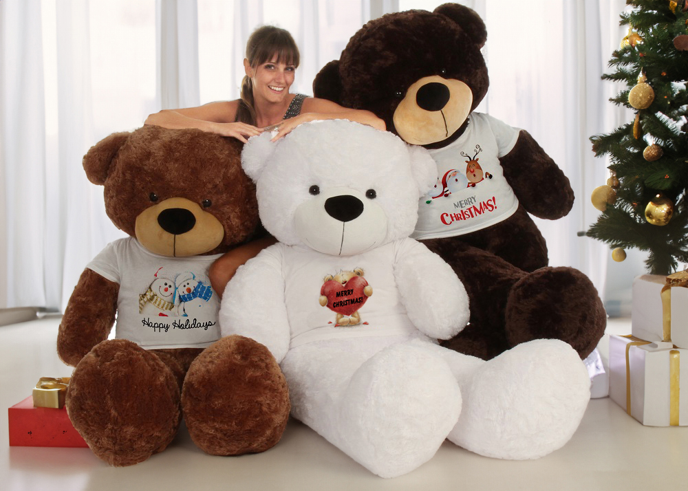 Three Large Teddy Bears Posing in Front of a Christmas Tree